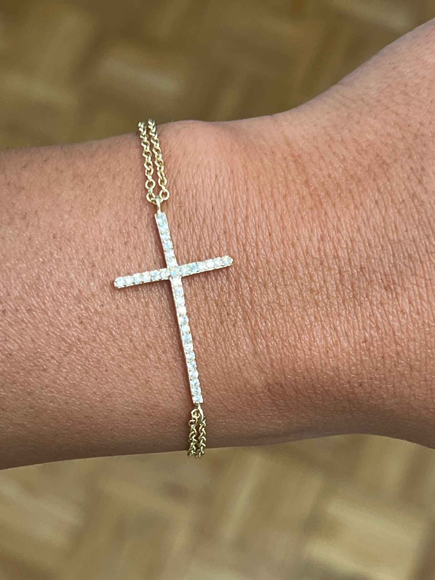 HARVARD, pulsera de plata dorada con cruz y circonitas.