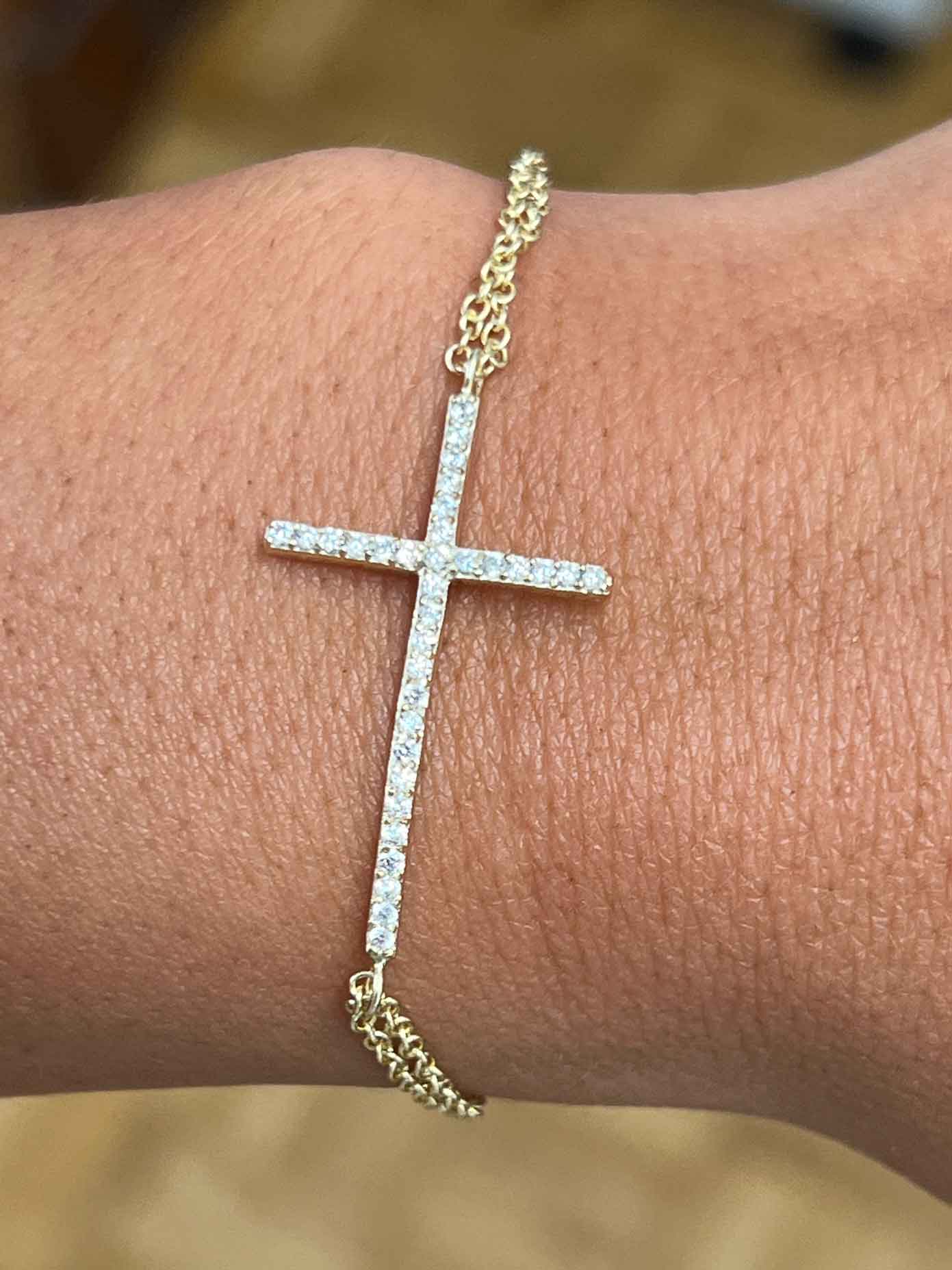 HARVARD, pulsera de plata dorada con cruz y circonitas.