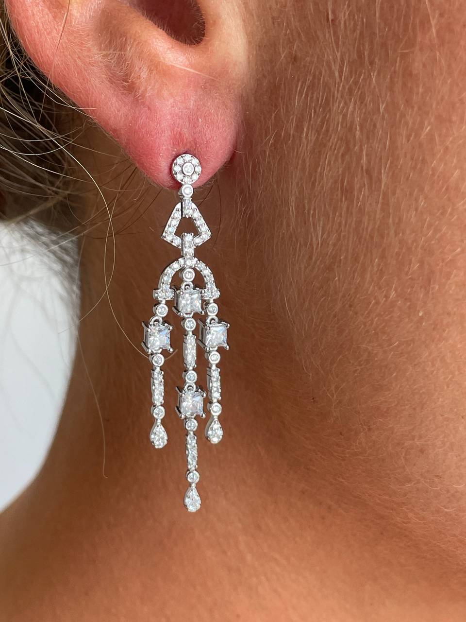 Long WARSAW earrings in white/emerald zircon spikes