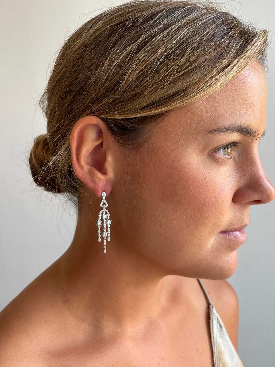 Long WARSAW earrings in white/emerald zircon spikes