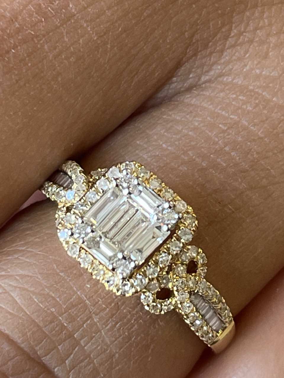 Cheeky ring with diamond center in 18k yellow gold.