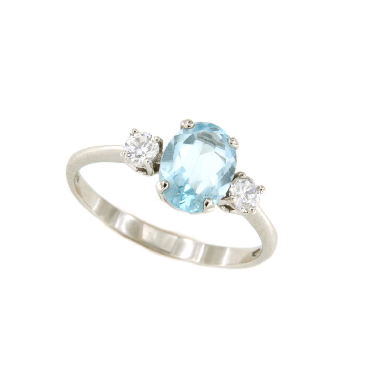 Anillo ESENCIA en oro blanco de 18 kilates con circonitas y topacio azul
