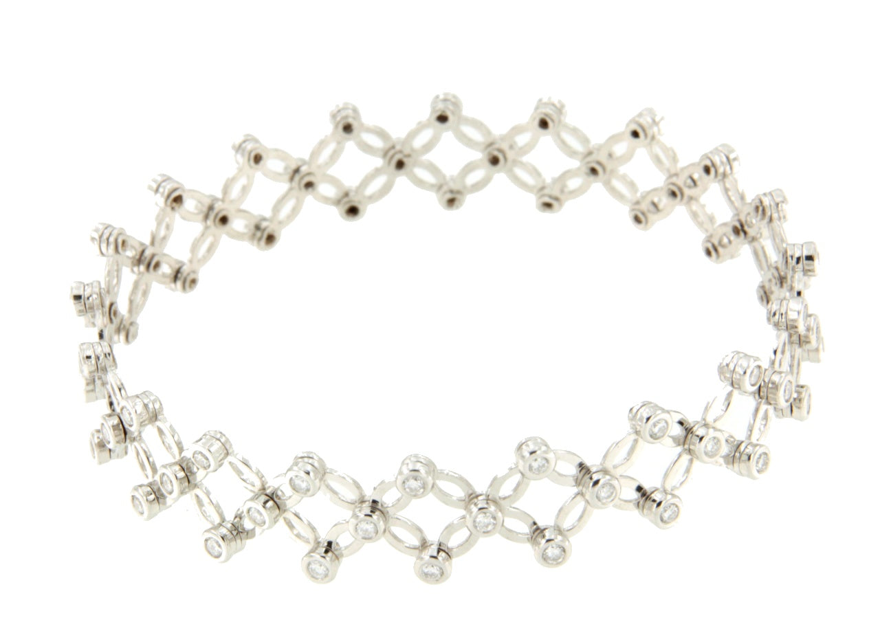 Anillo CAS y pulsera en brillantes de oro blanco en 18 kilates