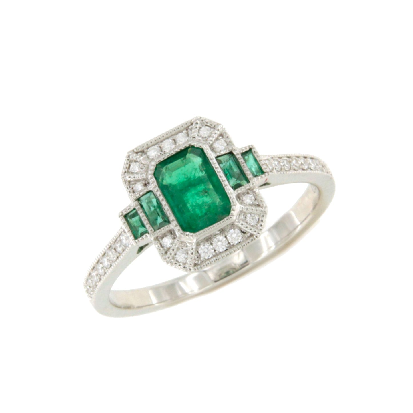Anillo DORTMUND roseta esmeralda baguettes y brillantes en oro blanco 18 ktes.