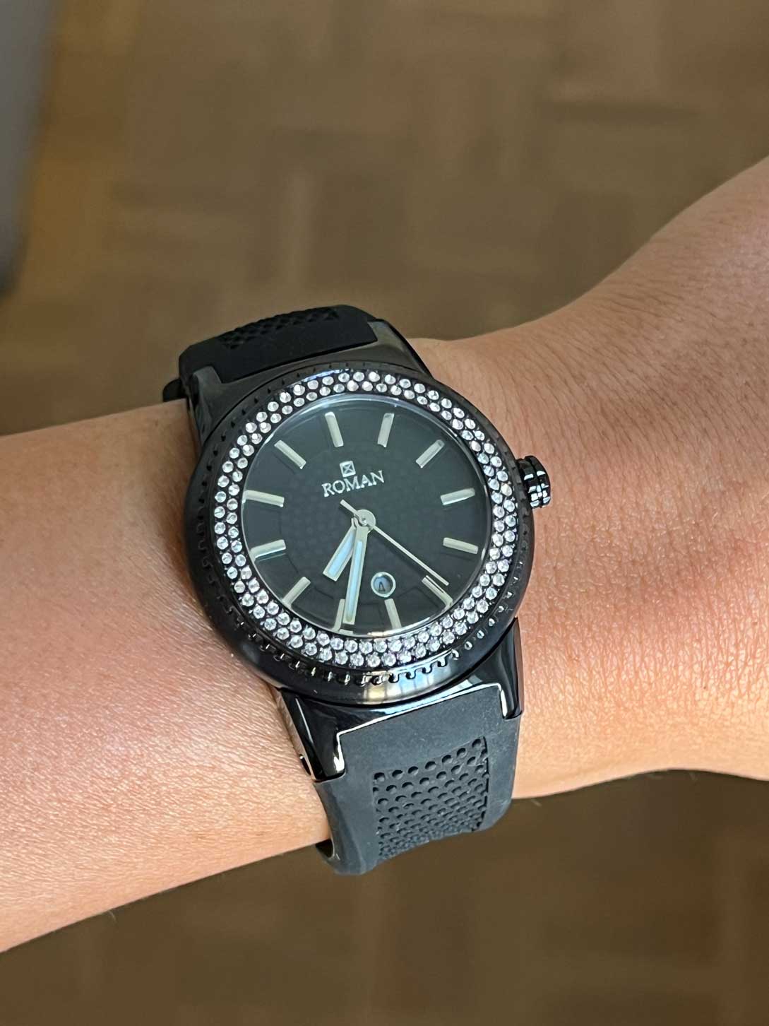 Roman watch, black and white with black rubber strap.