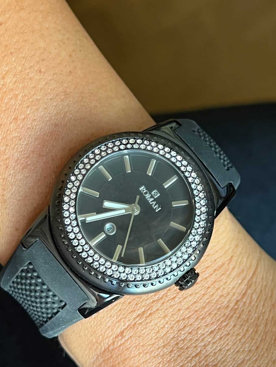 Roman watch, black and white with black rubber strap.