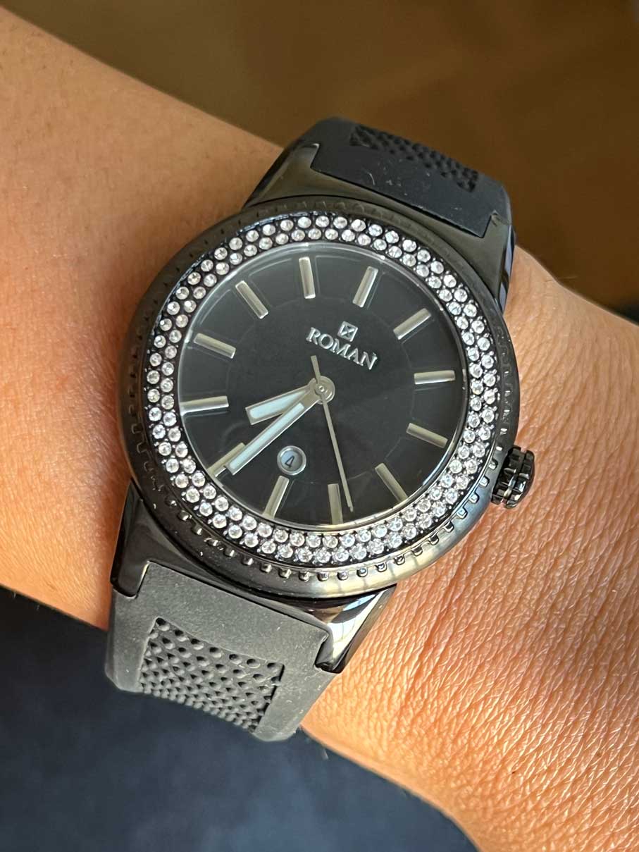 Roman watch, black and white with black rubber strap.