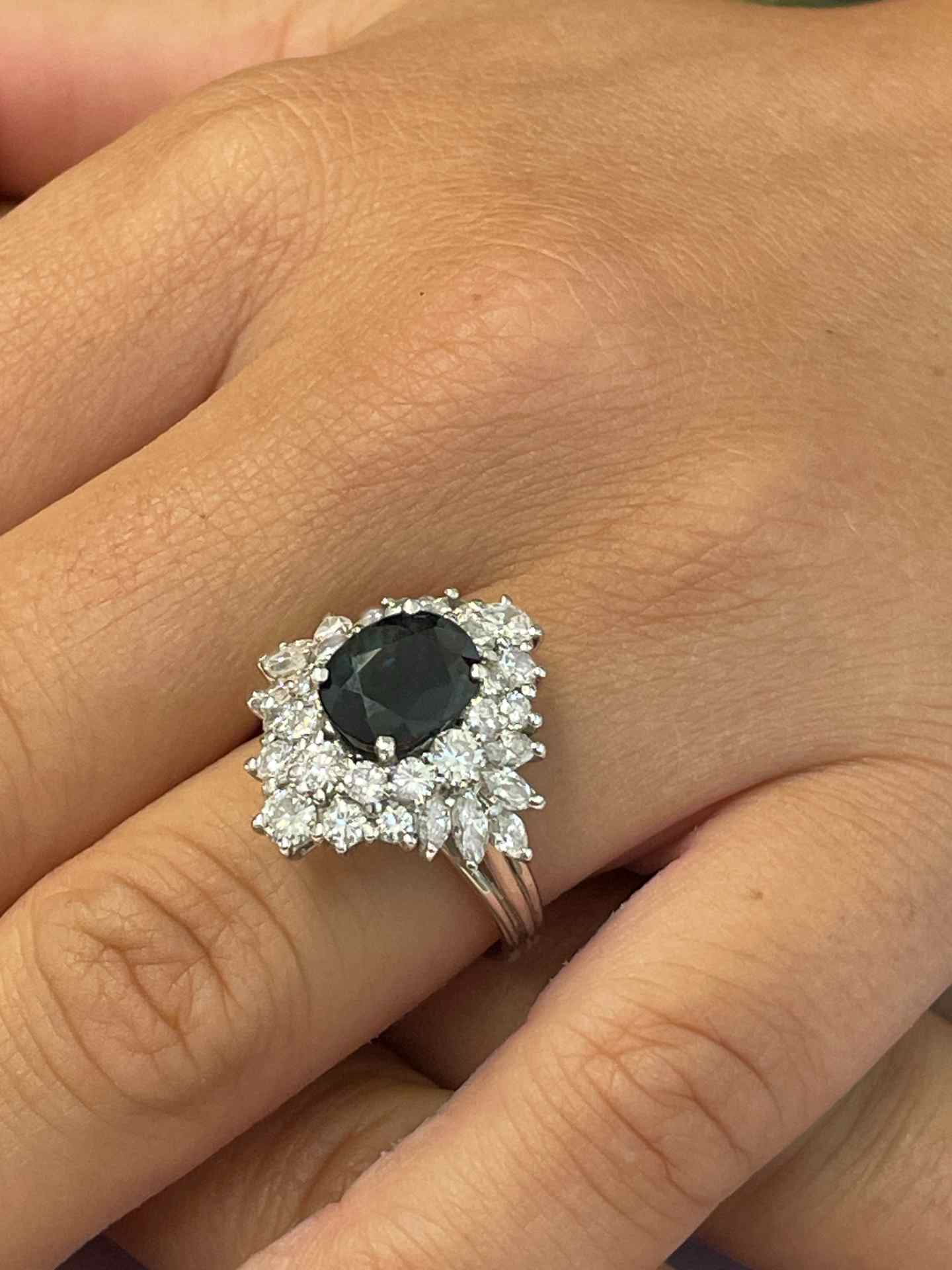 DURANGO ring with oval sapphire center and diamonds in 18k white gold.
