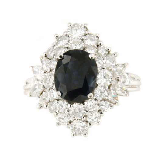 DURANGO ring with oval sapphire center and diamonds in 18k white gold.