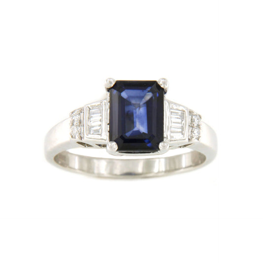POIO ring with sapphire center and diamonds in 18k white gold.