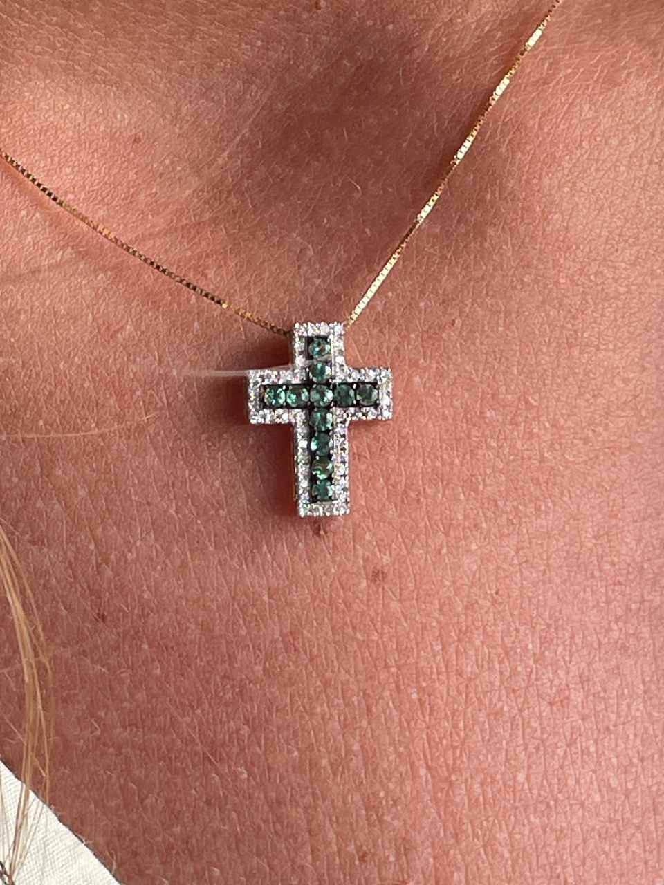 VELARA cross in 14k yellow gold with diamonds and emeralds