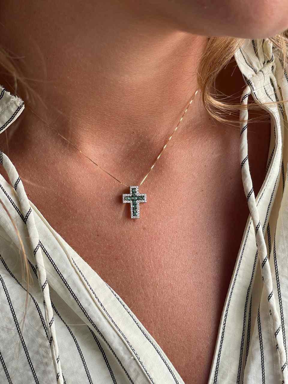 VELARA cross in 14k yellow gold with diamonds and emeralds