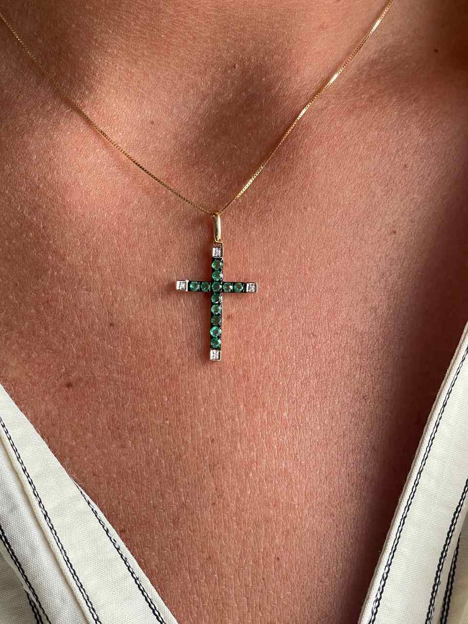 ESVARA cross in 14k yellow gold with diamonds and emeralds