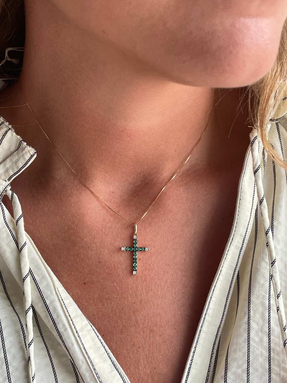 ESVARA cross in 14k yellow gold with diamonds and emeralds