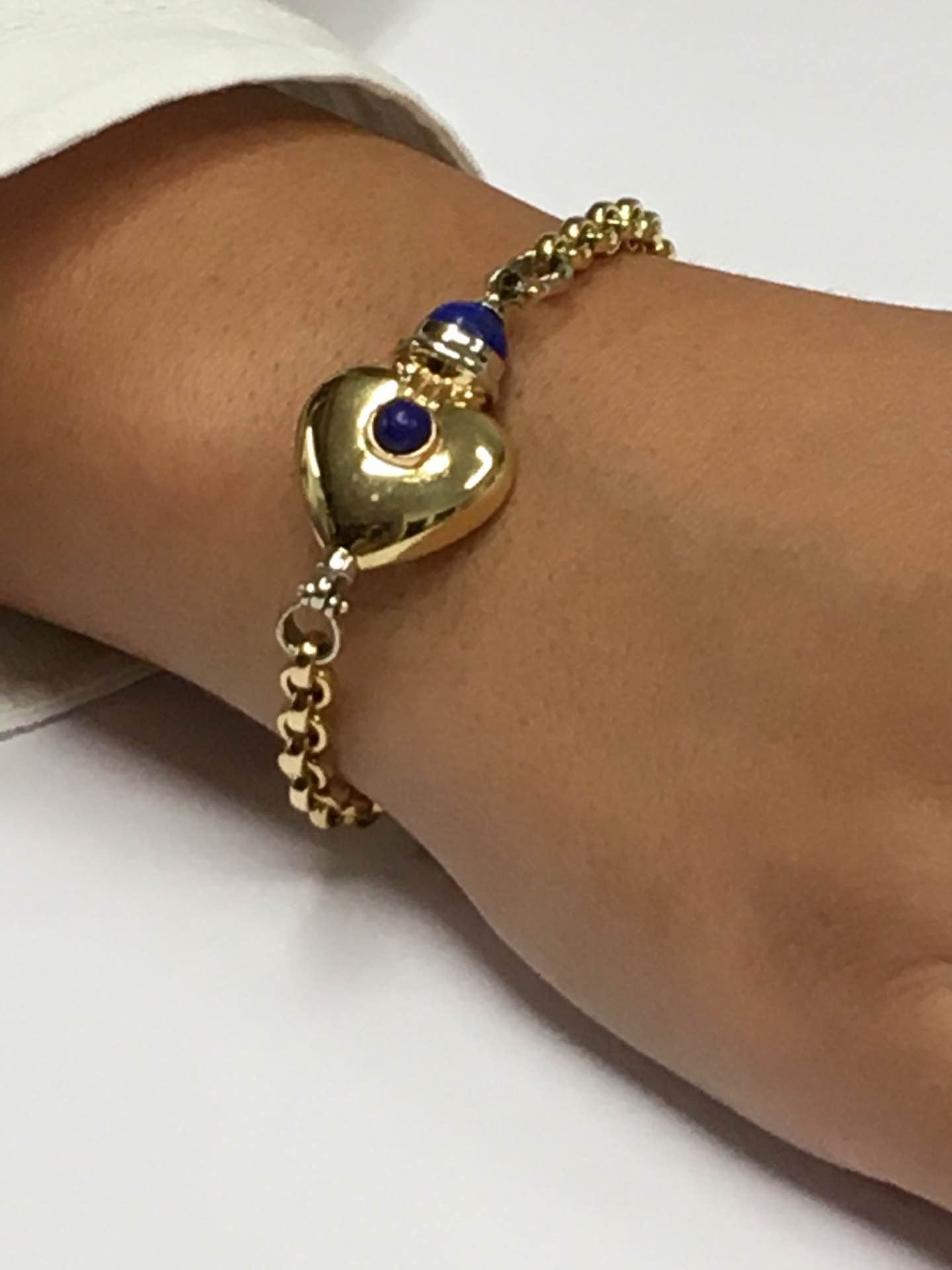 Pulsera KURT nueva en oro de 18 ktes con corazón y lapislázuli