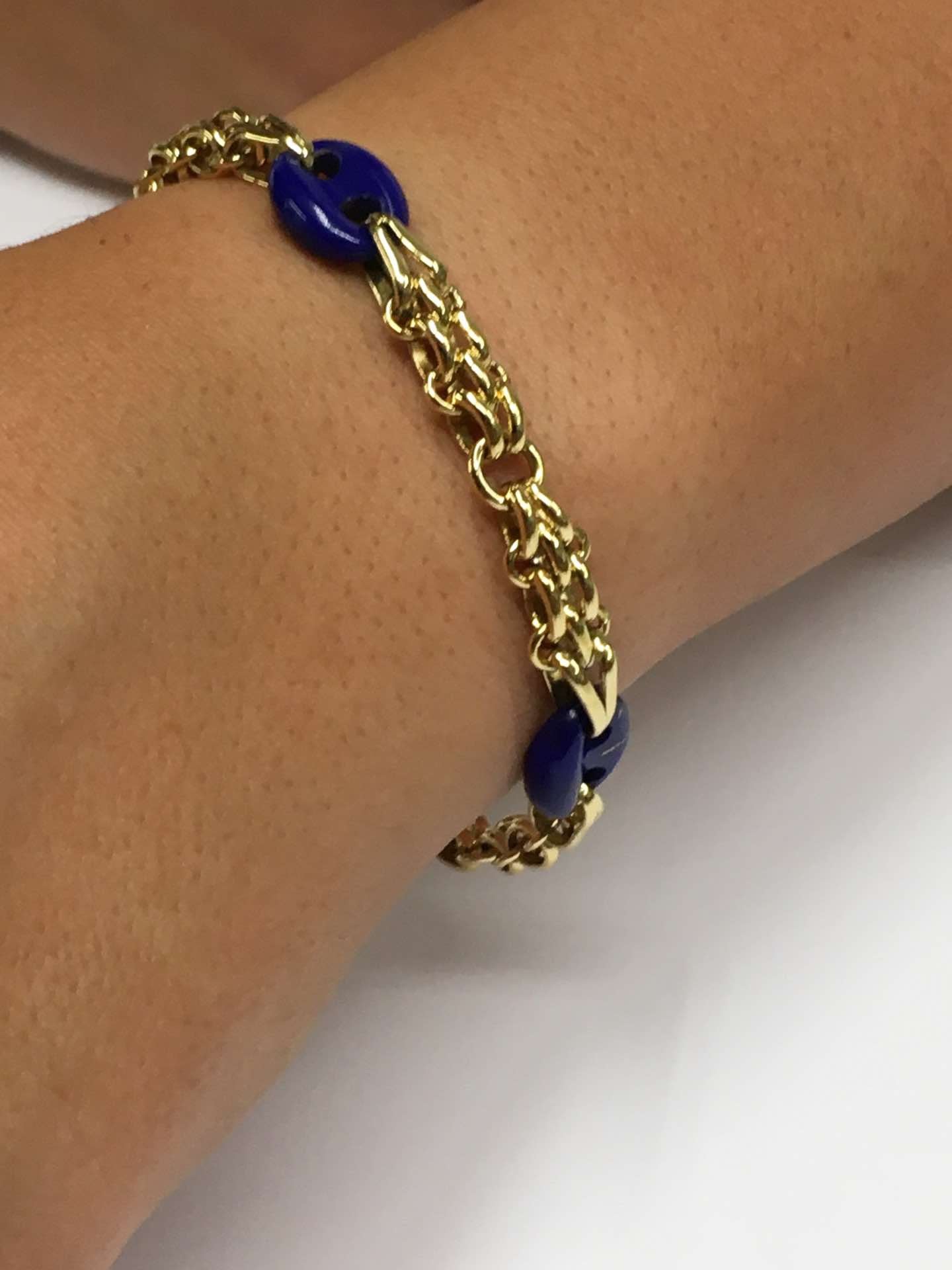 Pulsera SUNA oro 18 ktes amarillo y calabrotes en lapislázuli.