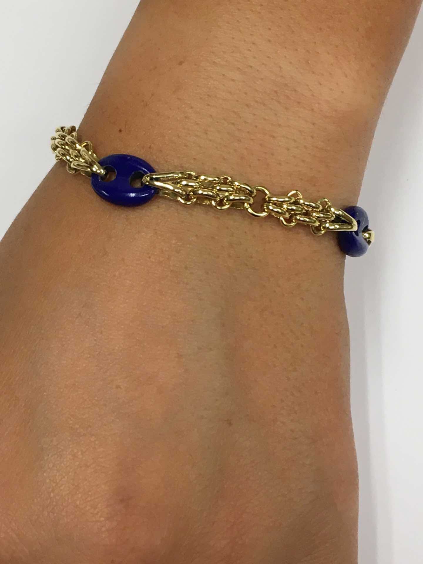 Pulsera SUNA oro 18 ktes amarillo y calabrotes en lapislázuli.