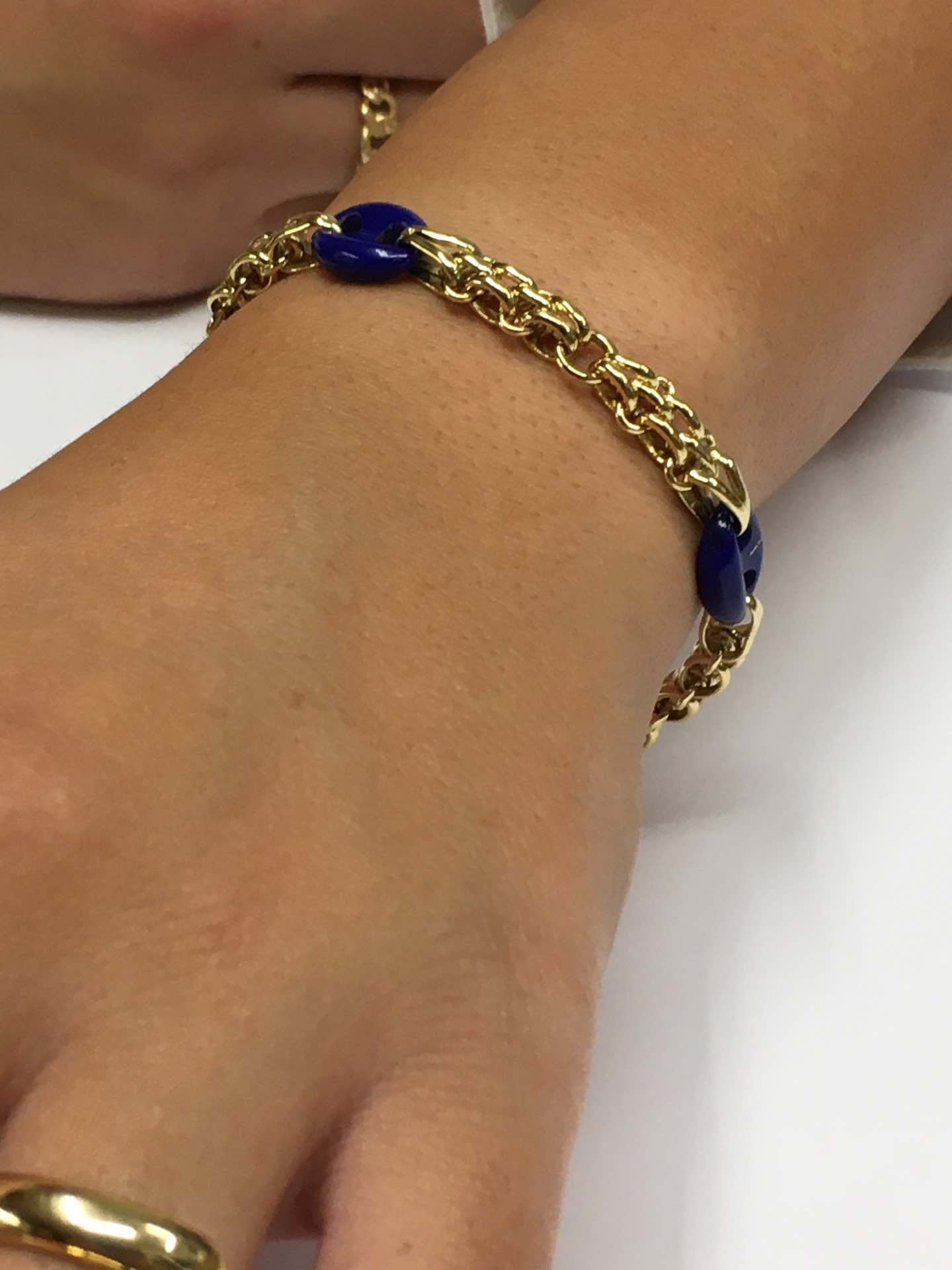 Pulsera SUNA oro 18 ktes amarillo y calabrotes en lapislázuli.