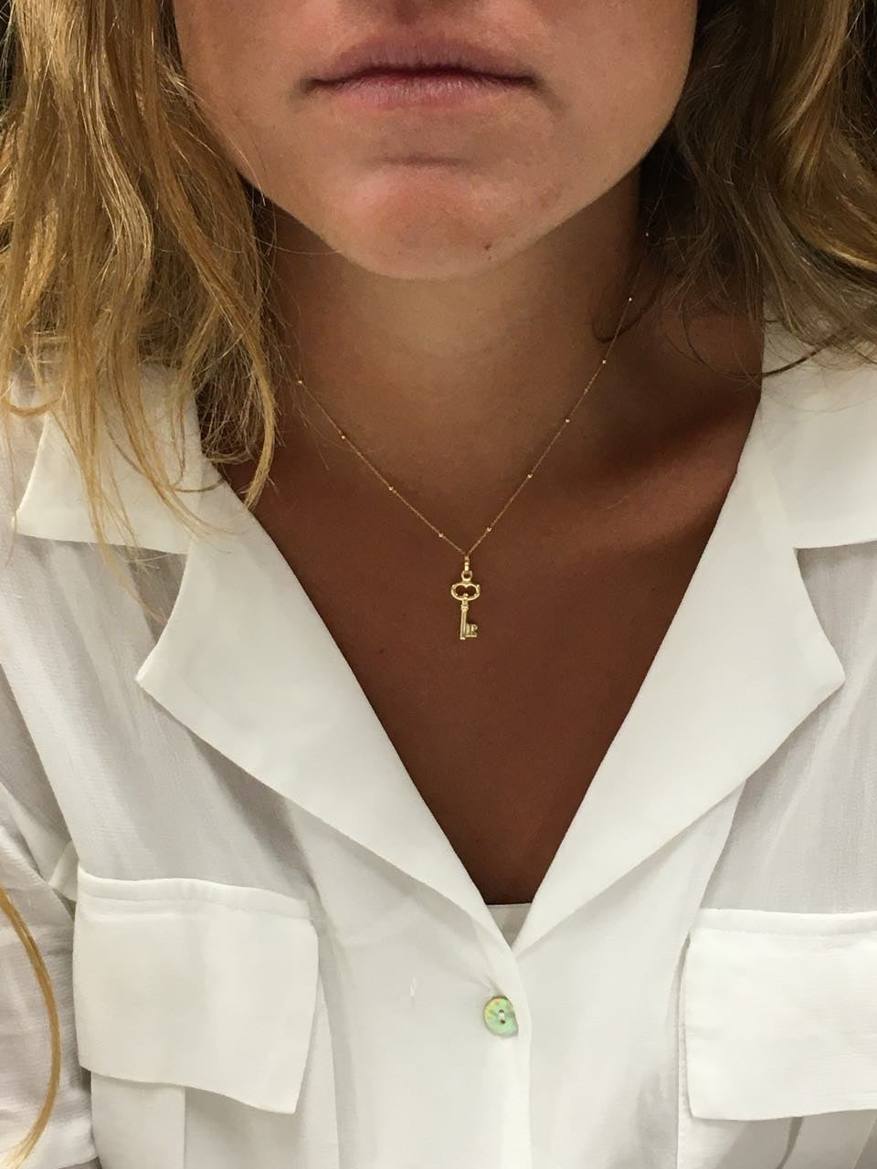 Colgante con un motivo llave AFRA en oro amarillo 18 Kilates. - Roman Joyero