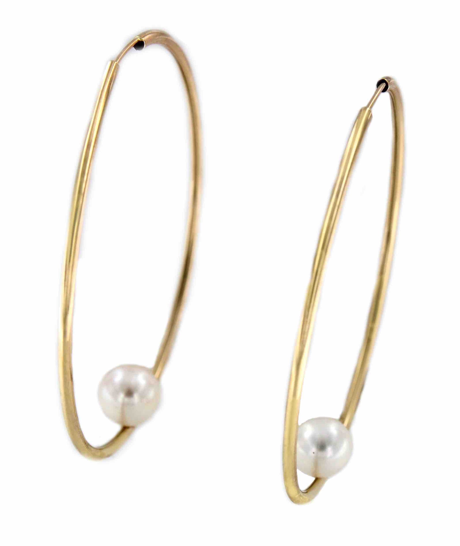 Argollas oro amarillo SOEL huecas en 18 kilates con perla
