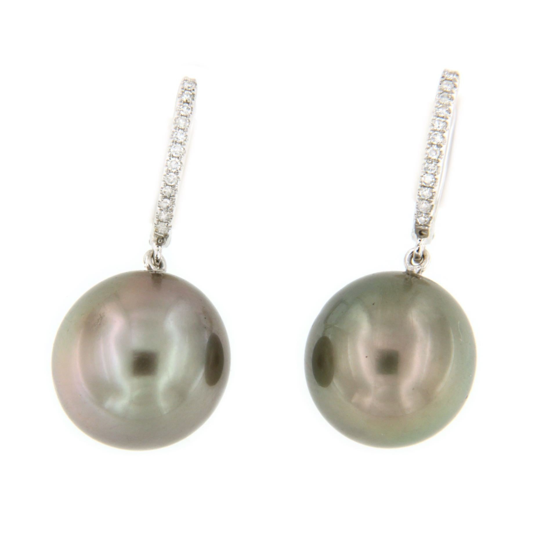 Argolla en oro de 18 kts, diamante y perla australiana negra