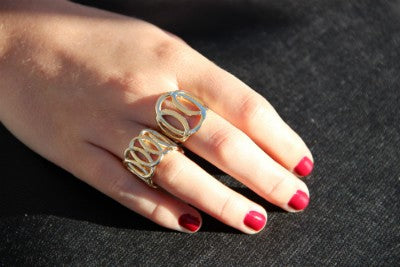 SION, anillo de plata dorada con 7 eslabones - Roman Joyero