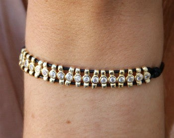 Pulsera de cuero con entre piezas de plata con baño de oro - Roman Joyero