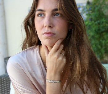 Pulsera de cuero con entre piezas de plata con baño de oro - Roman Joyero