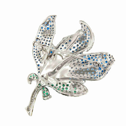 Broche MAGNOLIA flor de plata 925 ml con circonitas color zafiro y esmeralda