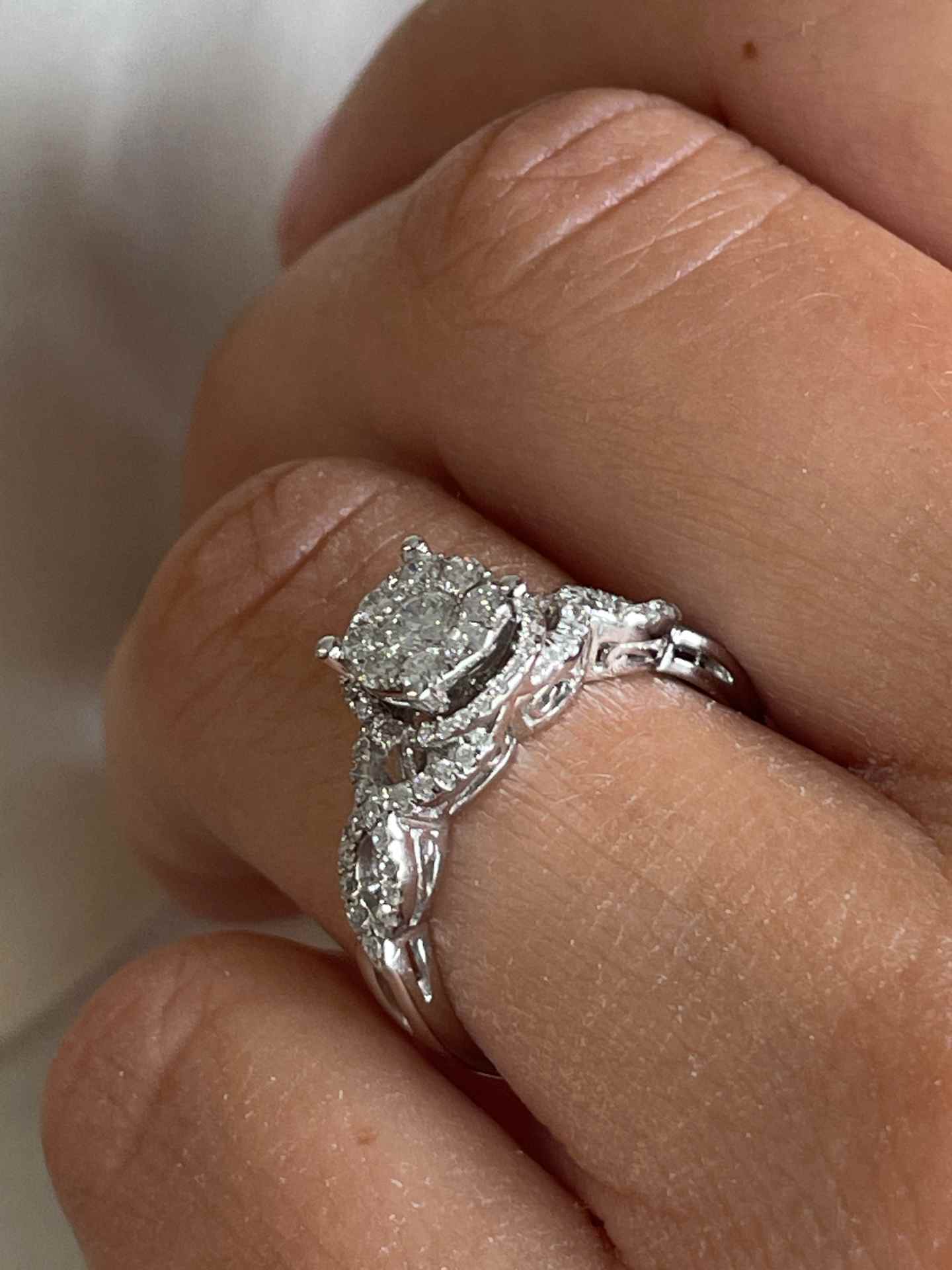 ACAI ring with rosette and halo and diamonds in 18-karat white gold