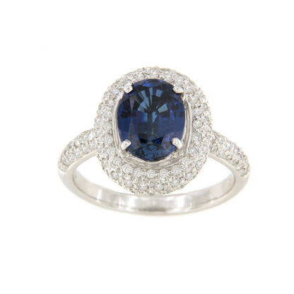 POIO ring with sapphire center and diamonds in 18k white gold.