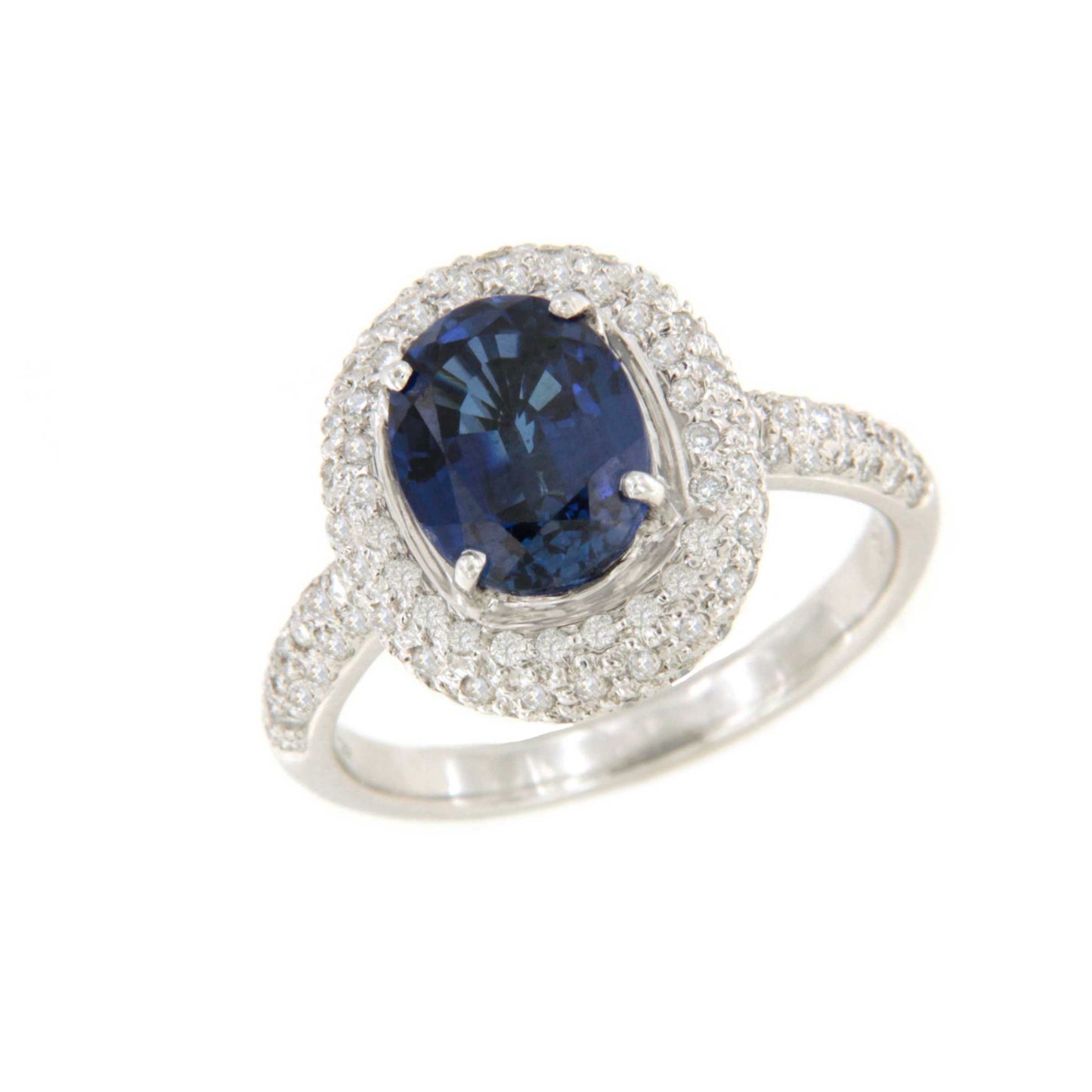 POIO ring with sapphire center and diamonds in 18k white gold.