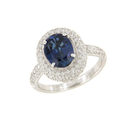 POIO ring with sapphire center and diamonds in 18k white gold.