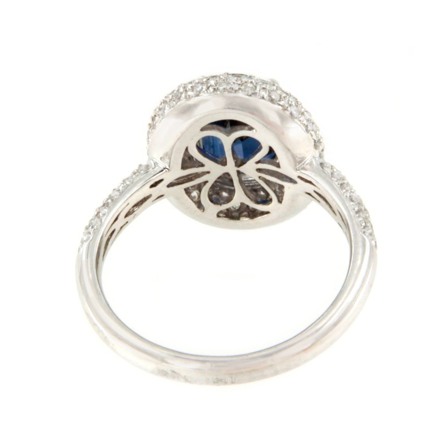 POIO ring with sapphire center and diamonds in 18k white gold.