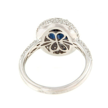 POIO ring with sapphire center and diamonds in 18k white gold.