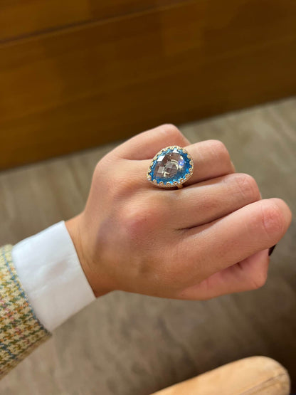 BOLERO, anillo de oro rosa con diamantes y topacio azul