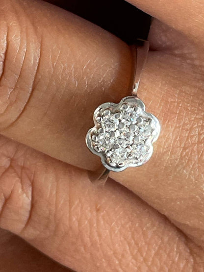 ACAI ring with rosette and halo and diamonds in 18-karat white gold