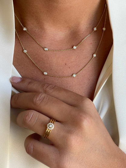 SAROY solitaire ring with diamond rosette in 18k yellow gold