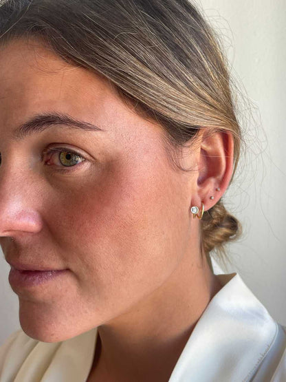 PEUMO short earrings in 18-karat yellow gold and diamonds.