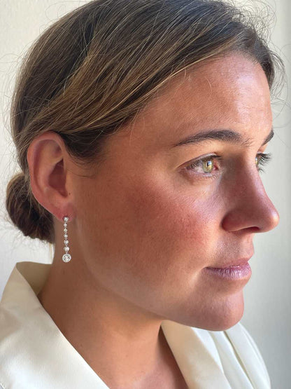 LIBIA long rosette diamond earrings in 18-karat white gold