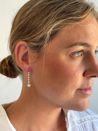 LIBIA long rosette diamond earrings in 18-karat white gold