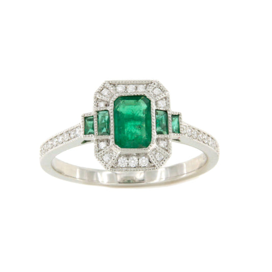 Anillo DORTMUND roseta esmeralda baguettes y brillantes en oro blanco 18 ktes.