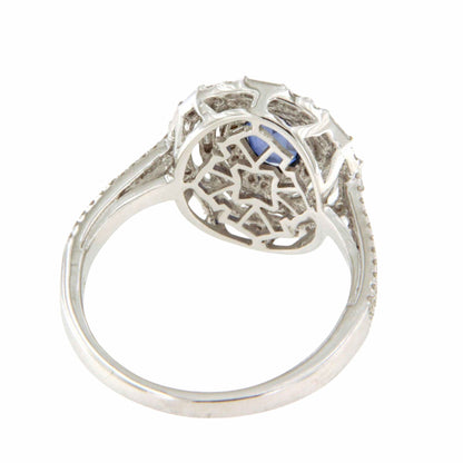 POIO ring with sapphire center and diamonds in 18k white gold.
