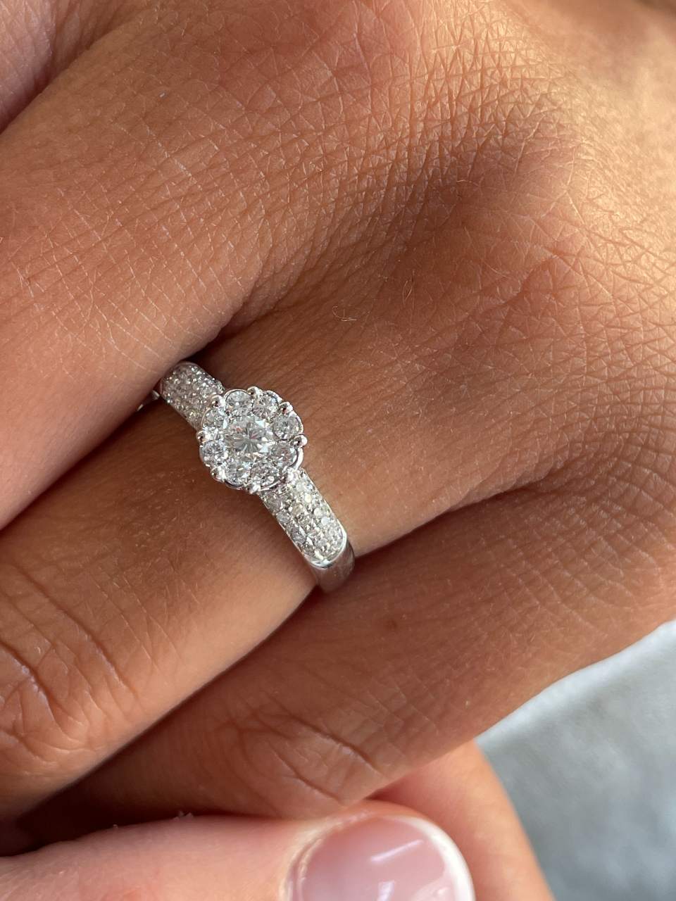 ACAI ring with rosette and halo and diamonds in 18-karat white gold