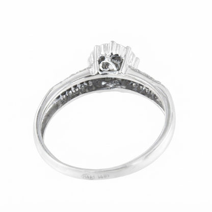 ACAI ring with rosette and halo and diamonds in 18-karat white gold