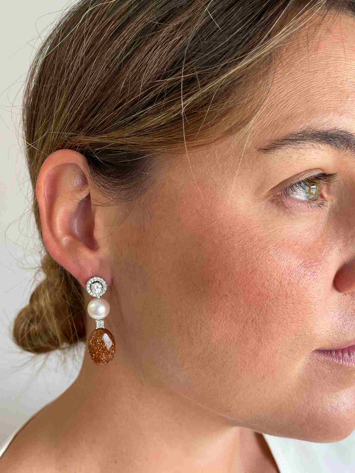 FERRARA solitaire earrings surrounded by diamonds in 18k white gold