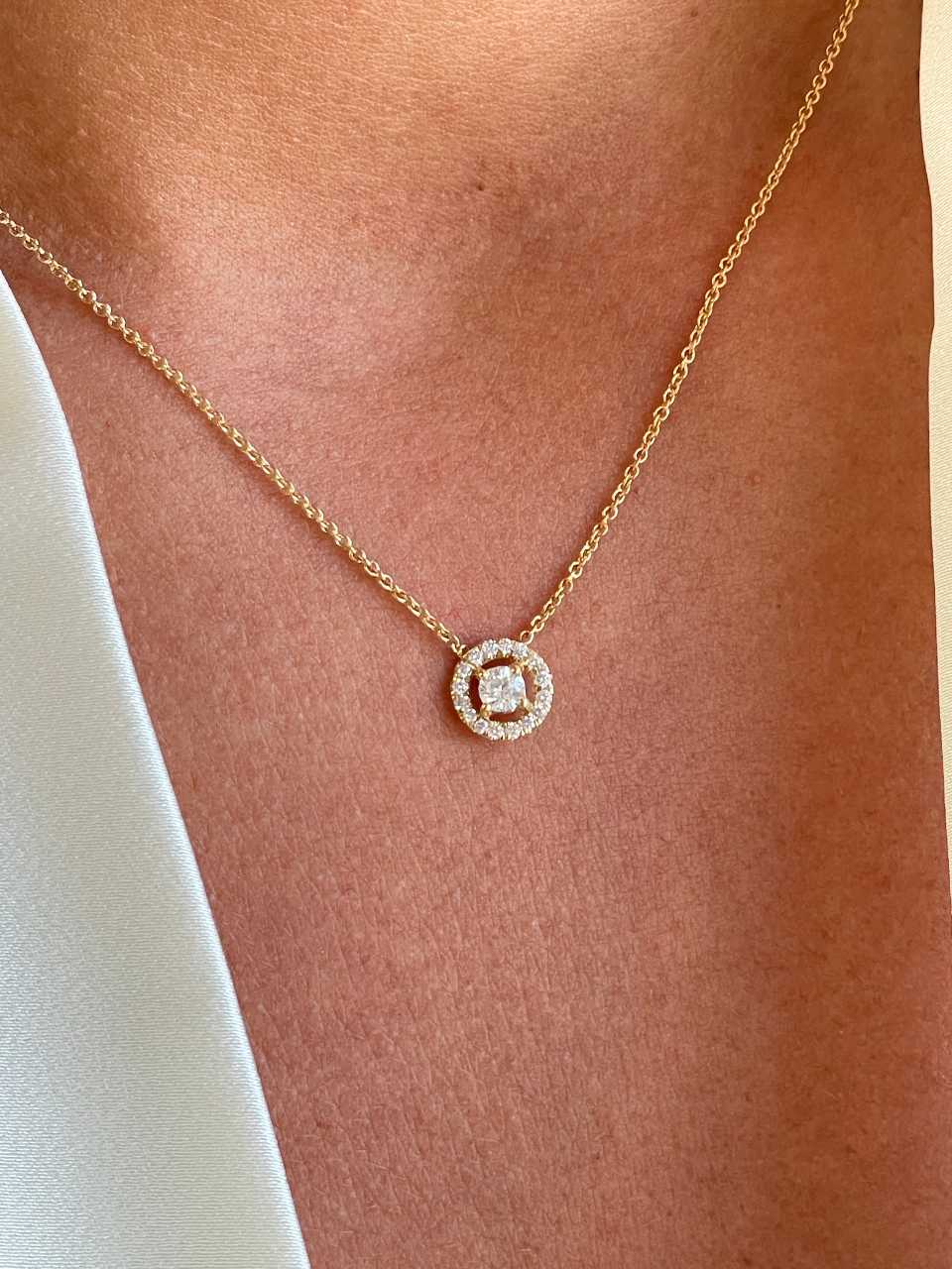 LINZ 18 Karat white gold chain with diamond solitaire.