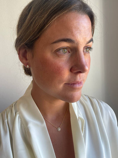 LINZ 18 Karat white gold chain with diamond solitaire.