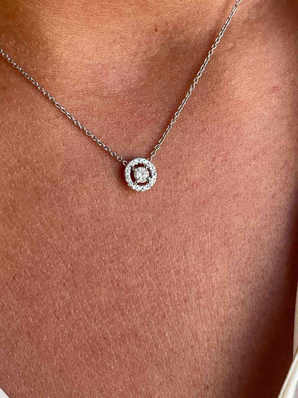 LINZ 18 Karat white gold chain with diamond solitaire.