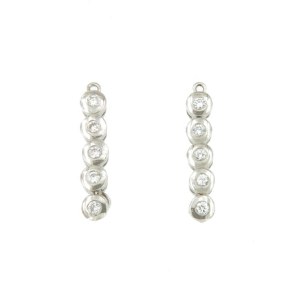 LUMISAR alargador de oro blanco de 18 kilates y brillantes